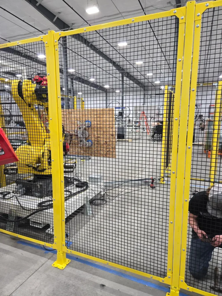 Panels and gates set up around robot arm